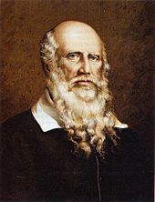 color lithograph of the bust of an elderly white man with a bald head except for long white hair on the sides of his head and a long beard that extends to his average breast. His white collar is visible above a simple black coat. His eyes are locked on the viewer's and his countenance is serious but calm.