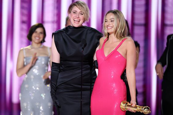 Greta Gerwig and Margot Robbie accept the award for Cinematic and Box Office Achievement for "Barbie" at the 81st Golden Globe Awards held at the Beverly Hilton Hotel on January 7, 2024